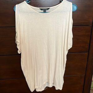 Cream color cold shoulder top with button accents in sleeve